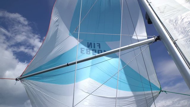 The wind blew up spinnaker at the bow of yacht