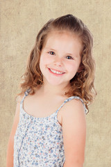 Smiling pretty little girl with curly hai