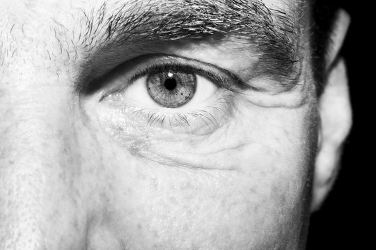 Image of man's monochrome  eye close up.
