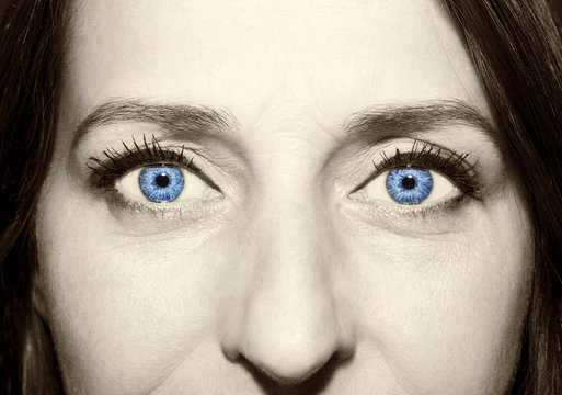 Beautiful insightful look blue vintage woman's eyes.
