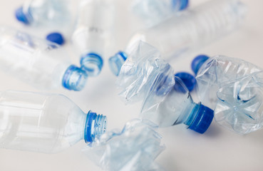 close up of empty used plastic bottles on table