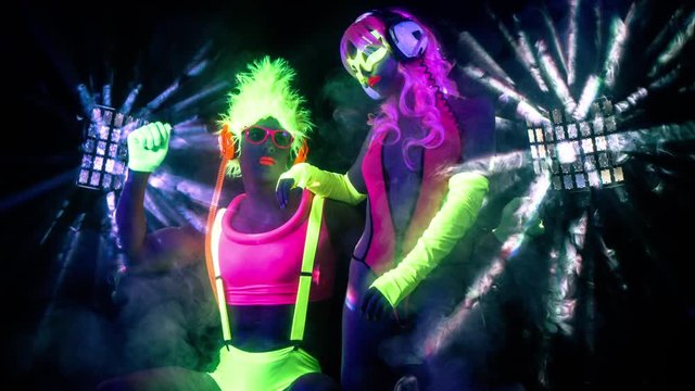 cyber raver couple in fluorescent UV glow