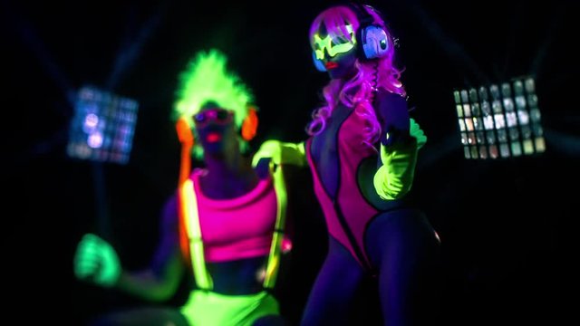 cyber raver couple in fluorescent UV glow
