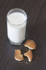 Glass of milk and biscuits with raisins