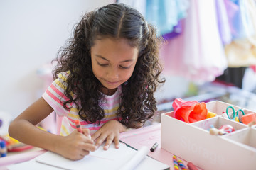 Girl drawing at desk