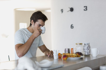 Man having breakfast at home