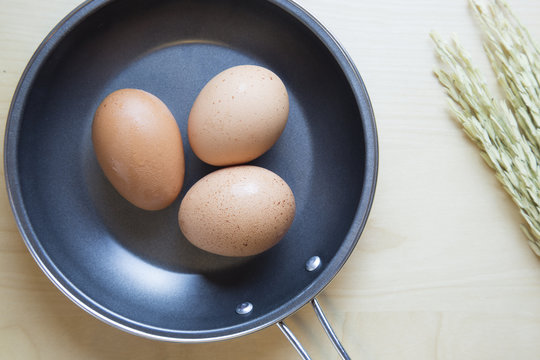 Fresh eggs in pan top view