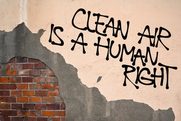 Clean Air Is A Human Right - Handwritten graffiti sprayed on the wall, anarchist aesthetics....