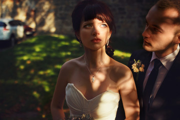 Bride looks fatal rising her eyes up in the sky