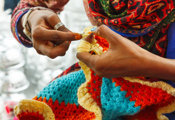 Hands of Indian woman khitting