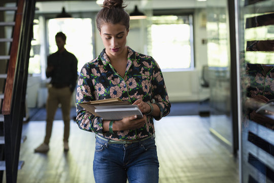 Close-up of a businesswoman looking at files