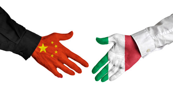 China and Italy leaders shaking hands on a deal agreement