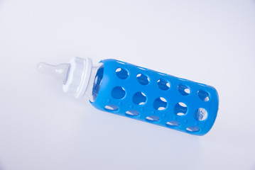 baby glass bottle. baby glass bottle on a background.