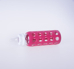 baby glass bottle. baby glass bottle on a background.