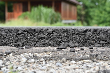 Cross section of asphalt road (top layer is an asphalt and bottom layer is an crushed rock )