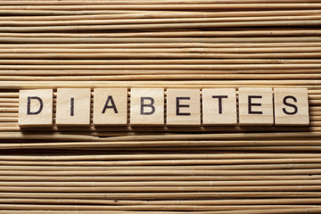 word diabetes on wooden cubes at wood background