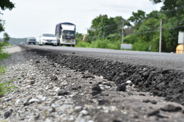 Cross section of asphalt road (top layer is an asphalt and bottom layer is an crushed rock )