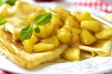 Thin pancakes with caramelised apples and cinnamon.