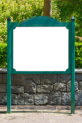 Blank white billboard green signpost in the park.