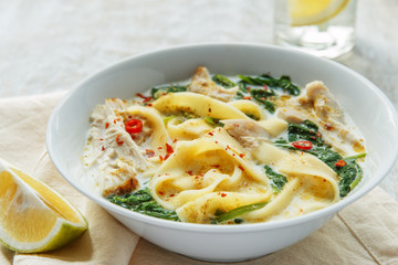 Coconut Curry Chicken Soup with noodles in a plate