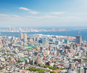 Fototapeta na wymiar Kobe cityscape and skyline with port view from mountain.