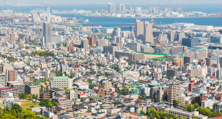 Fototapeta na wymiar Kobe cityscape and skyline with port view from mountain.
