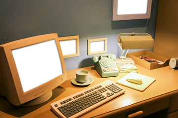 Retro office desk in dark room with simulator object.