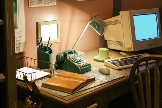 Retro Office Desk In Dark Room With Simulator Object.