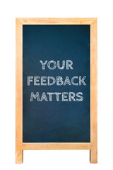 Your feedback matters text message on wood frame board