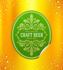Green beer label with flourishes emblem on a yellow beer glass background - vector illustration