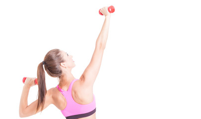 Female doing exercises with pair of dumbbells