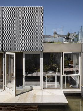 Water feature and textured exterior of a modern house