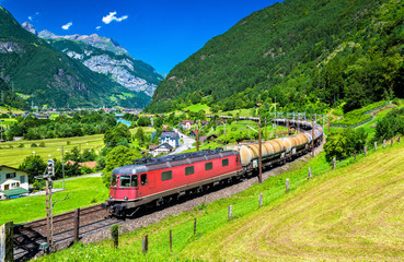 Fototapeta premium Freight train climbs up the Gotthard railway - Switzerland