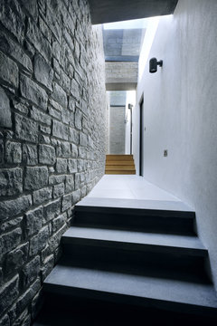 View along a stone-clad corridor