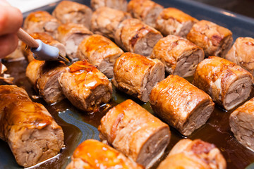 meat rolls on metallic platter