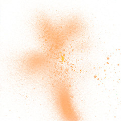 Orange spray paint on white background