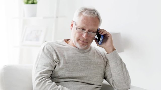 happy senior man calling on smartphone at home 127