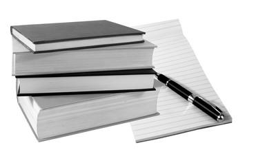 Books, pad and pen on a white background