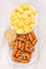 overheadl making frankfurters with whole mini fries