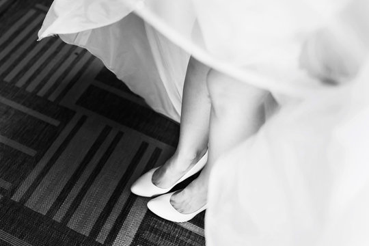 A look from above on pretty bride's legs