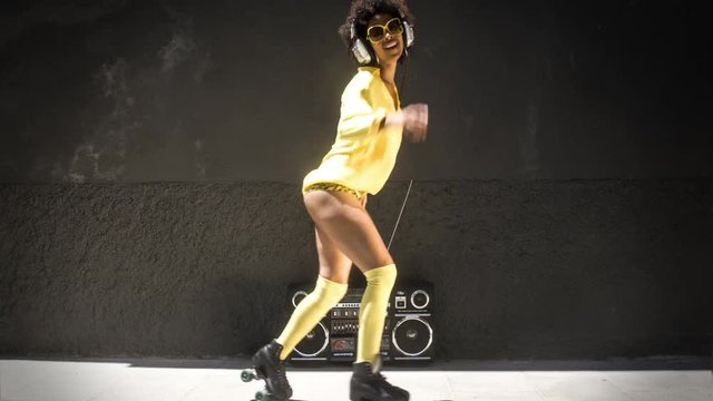 cool roller skating woman dances and skates