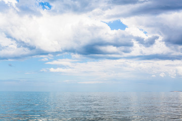 Obraz premium waterscape with white clouds and calm Azov Sea