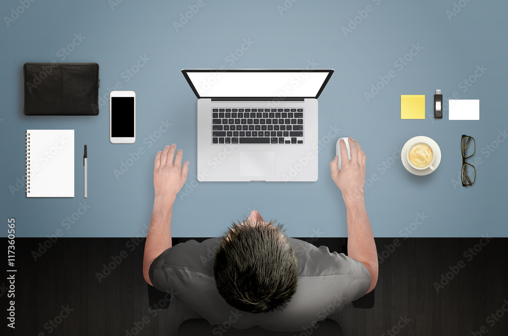 Poster Top view of office desk. Designer working on a laptop with isolated display for mockup.