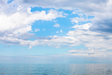 Naklejka na ściany i meble scenery of blue sky with white clouds over calm sea