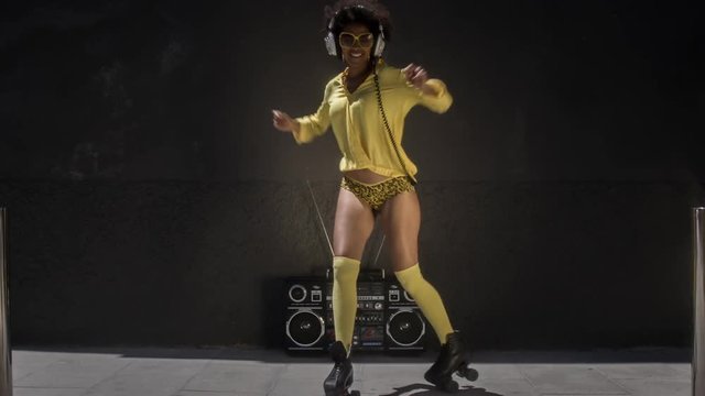 cool roller skating woman dances and skates