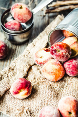 Fresh peaches in a tin, autumn rustic background,.healthy raw fo