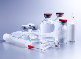 Vials and syringe, studio shot. Medical objects for vaccination. Vaccine drew up into a syringe. 