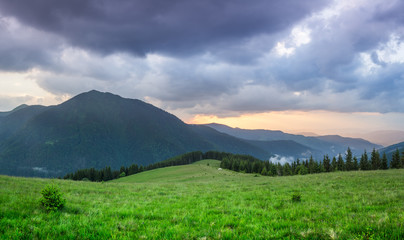 Fototapeta premium Summer landscape with the sunset in the mountains