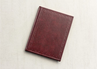 book red on a grey background, top view