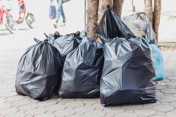 Big pile of garbage and waiste in black bags